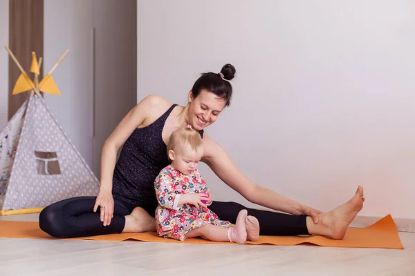 Mother Practices Yoga Home Her Child Together Sport Young Mom — Stock Photo, Image