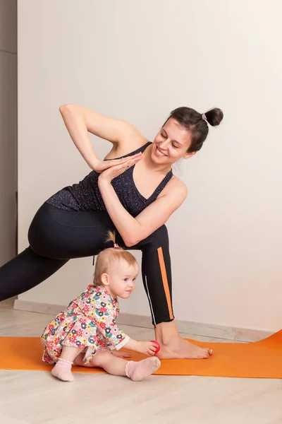 Mother Practices Yoga Home Her Child Together Sport Young Mom — Stock Photo, Image