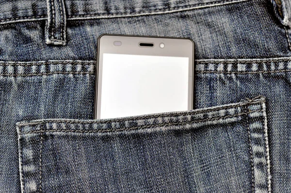 Telefone celular, celular no bolso traseiro jeans azuis — Fotografia de Stock