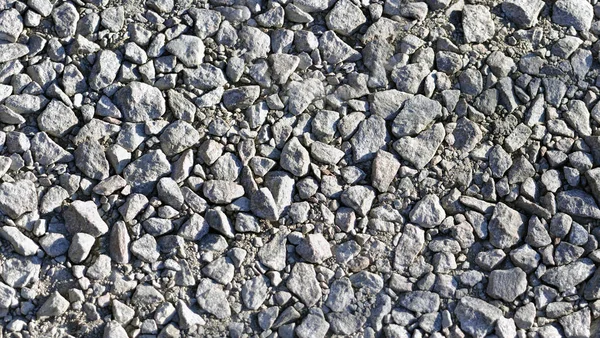 A textura de cascalho pequena parede de pedra, mármore, cascalho de granito . — Fotografia de Stock