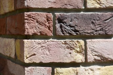 Köşe renkli tuğla duvar arka plan