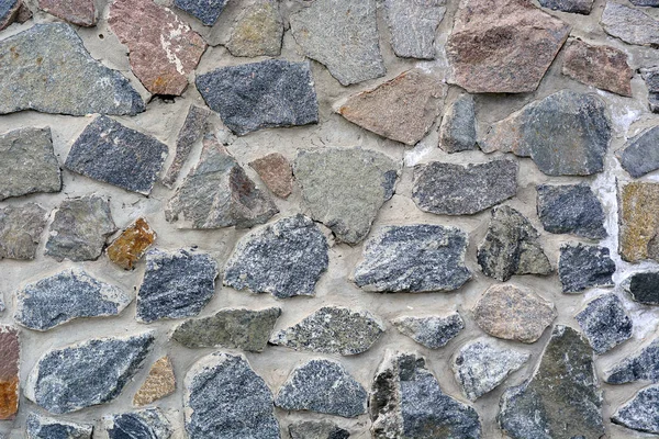 Textur alte Ziegel- oder Steinmauer aus Kopfsteinpflaster Hintergrund. — Stockfoto