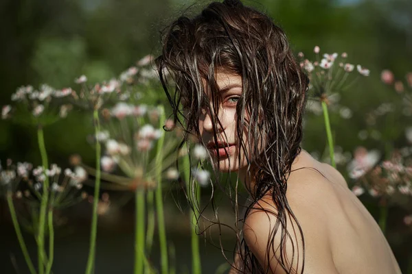 Young brunette in water — Stock Photo, Image