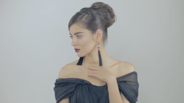 Beautiful brunette woman touch her collarbones slowly — Stock Video