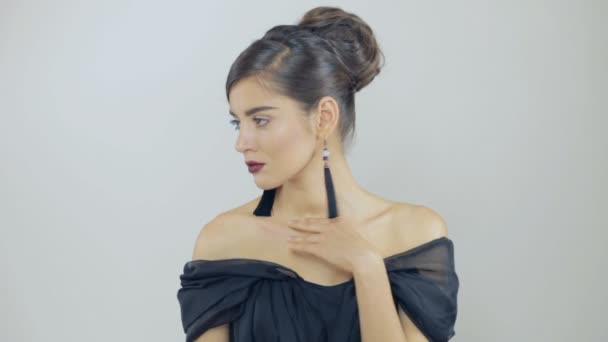 Beautiful brunette woman touch her collarbones slowly — Stock Video