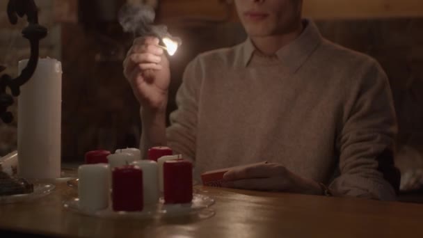 Young Man Lighting Candles Slow Motion Shallow Depth Field — Stock Video