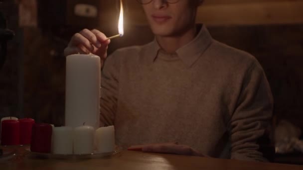 Young Man Lighting Candles Slow Motion Shallow Depth Field — Stock Video