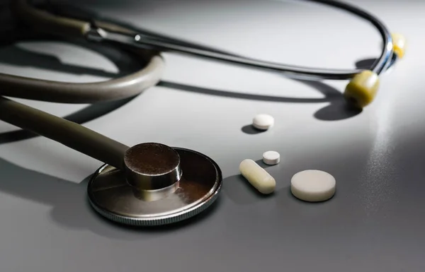 Stethoscope is large, in the center of the pill and capsule.
