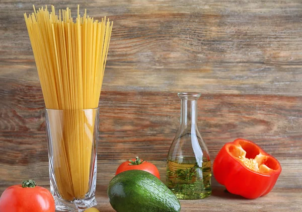 Composition with raw pasta on table — Stock Photo, Image