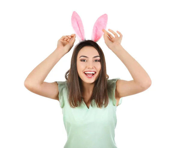 Beautiful young woman with Easter bunny ears on white background — Stock Photo, Image