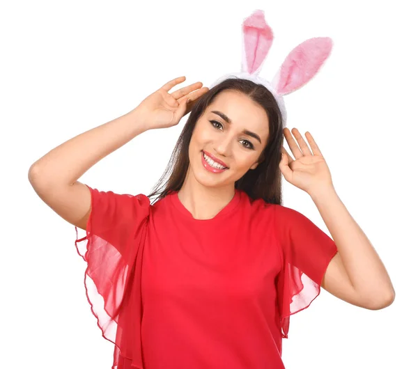 Beautiful young woman with Easter bunny ears on white background — Stock Photo, Image