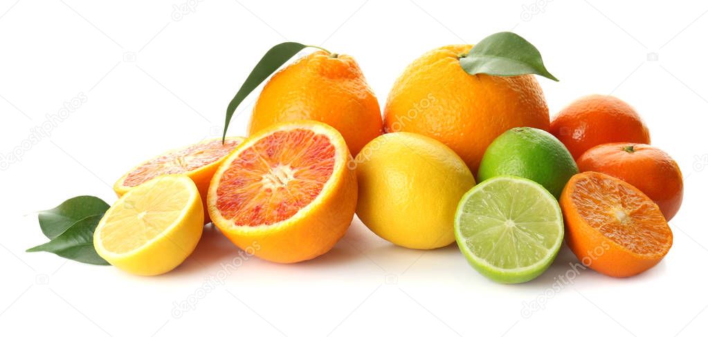 Different tasty citrus fruits on white background