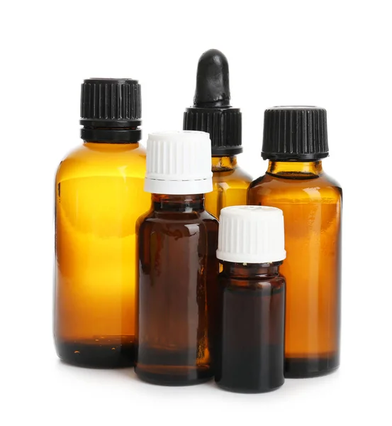 Bottles with essential oils on white background — Stock Photo, Image