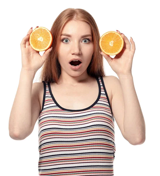 Emotional young woman with citrus fruit on white background — Stock Photo, Image