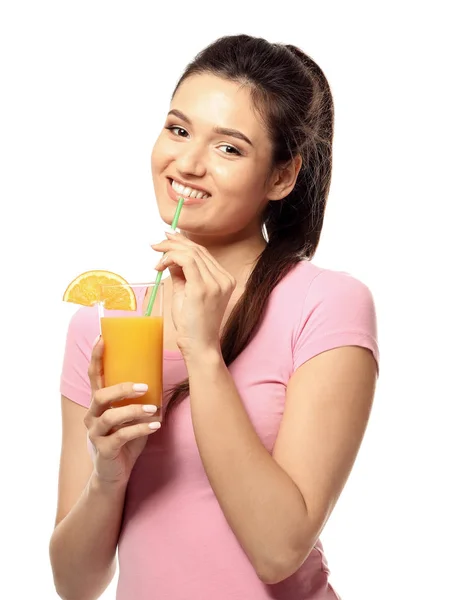 Beautiful young woman with glass of citrus juice on white background — Stock Photo, Image