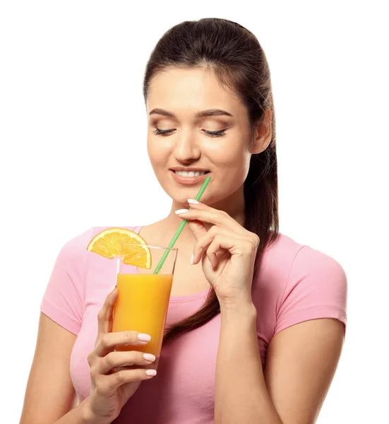 Beautiful young woman with glass of citrus juice on white background — Stock Photo, Image