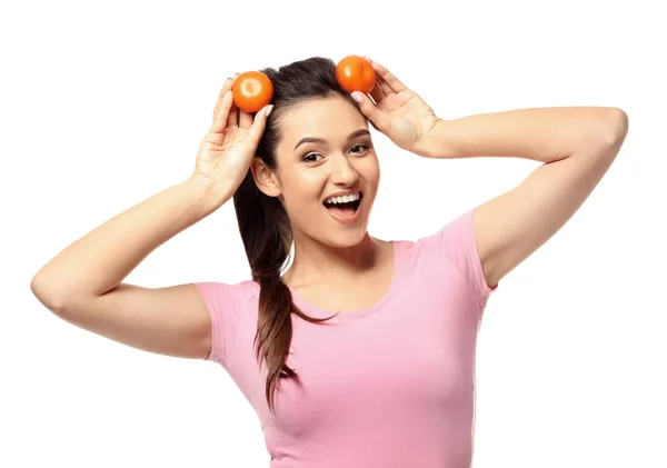 Funny young woman with citrus fruit on white background — Stock Photo, Image