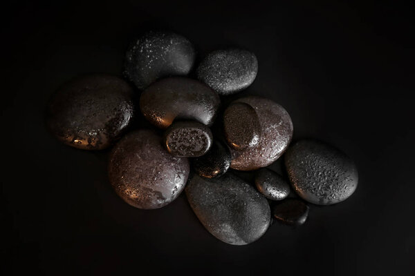 Pile of spa stones on dark background