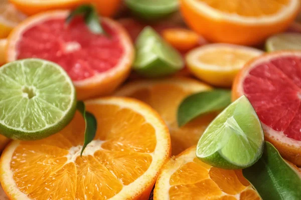 Slices of fresh citrus fruits, closeup — Stock Photo, Image