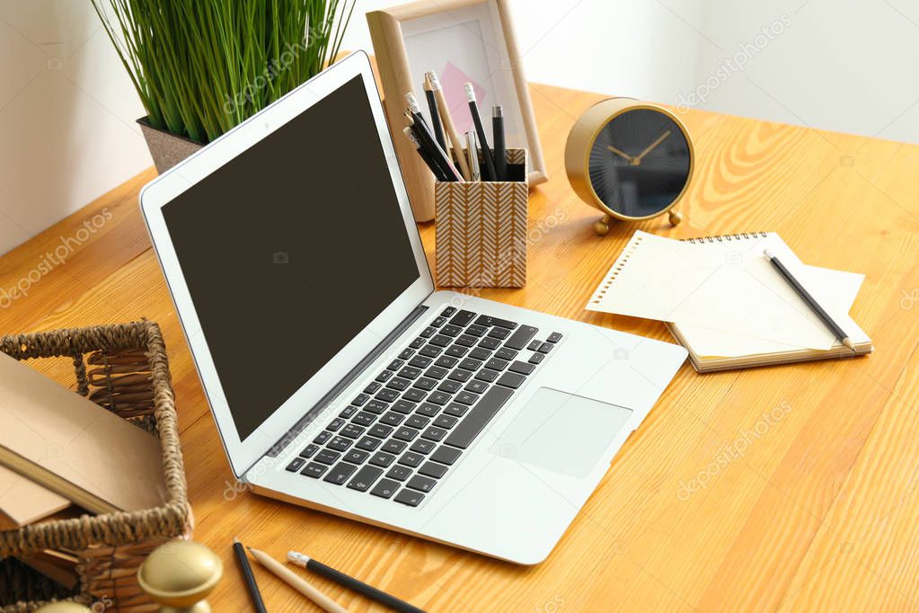 Comfortable home workplace with laptop on table