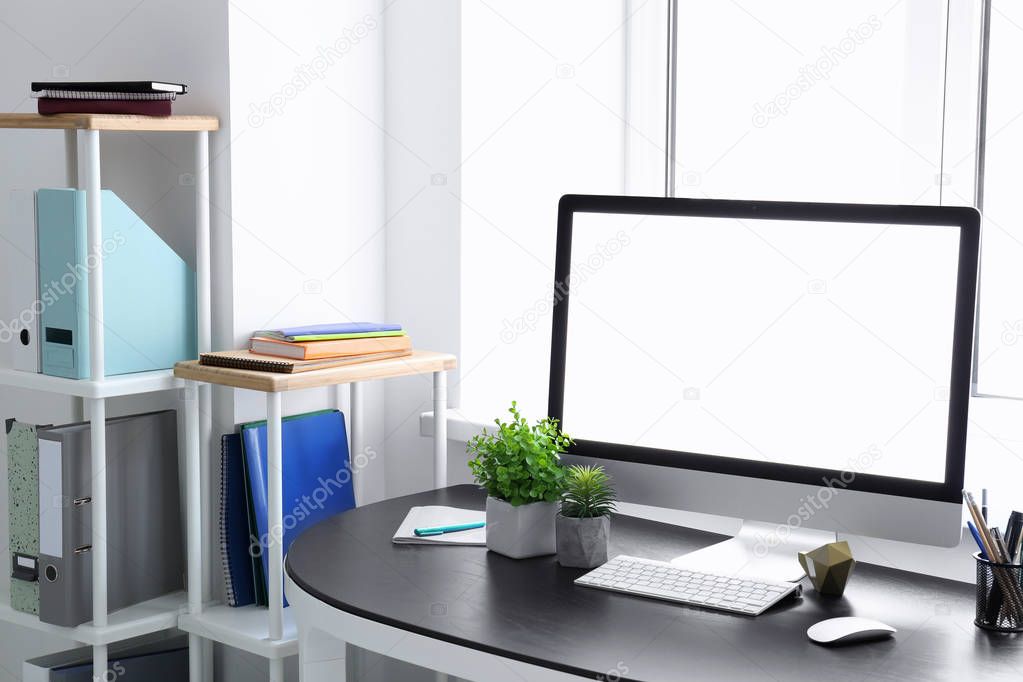 Comfortable home workplace with computer on table