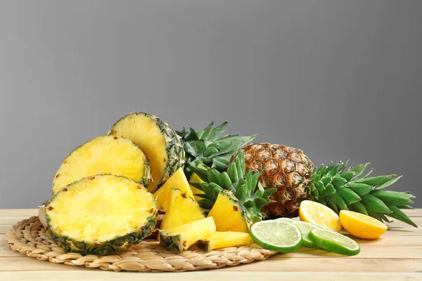 Composition with fresh sliced pineapples on table — Stock Photo, Image