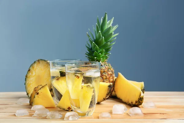 Composition with fresh sliced pineapple and glasses of water on table — Stock Photo, Image