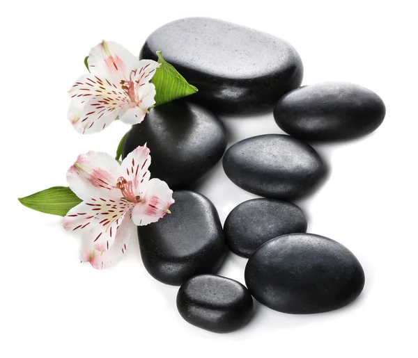 Spa stones and beautiful flowers on white background — Stock Photo, Image