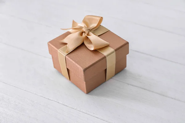 Beautiful gift box on wooden table — Stock Photo, Image