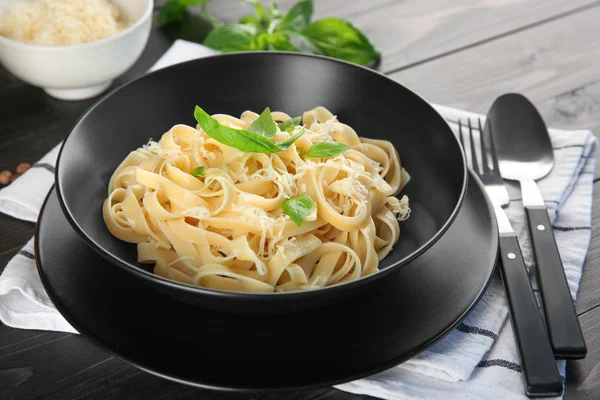 Plate of delicious pasta with cheese on table — Stock Photo, Image