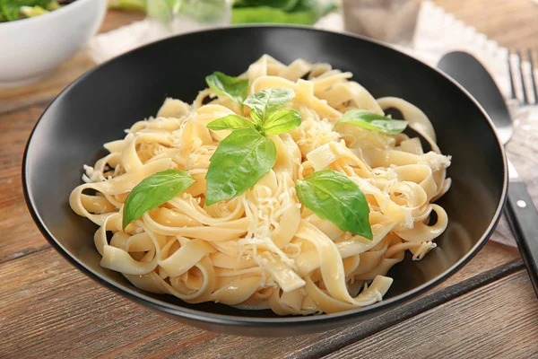 Plate of delicious pasta with cheese on table — Stock Photo, Image