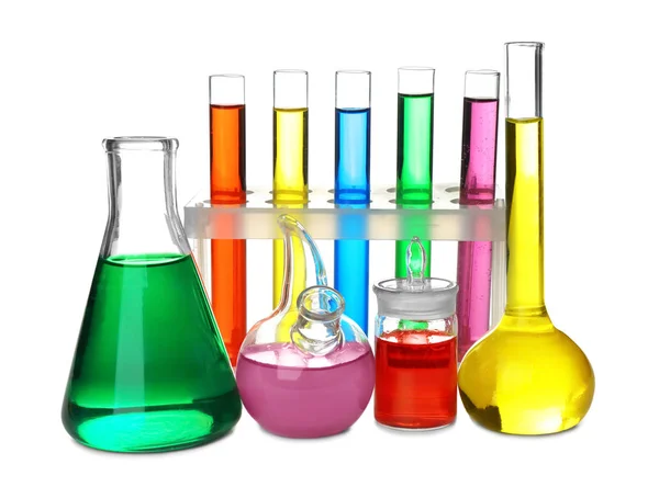 Chemical glassware with colorful samples on white background — Stock Photo, Image