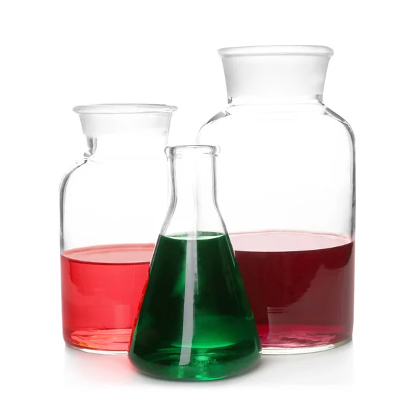 Chemical glassware with colorful samples on white background — Stock Photo, Image