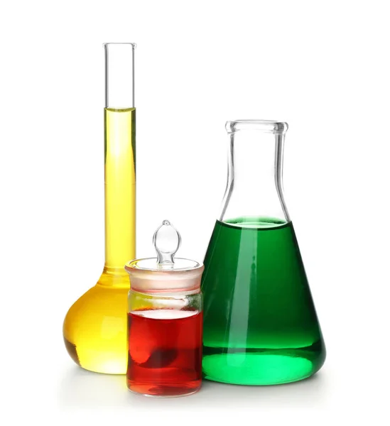 Chemical glassware with colorful samples on white background — Stock Photo, Image