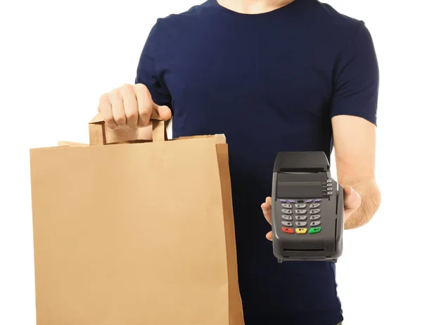 Delivery man holding paper bag with food and payment terminal on white background — Stock Photo, Image