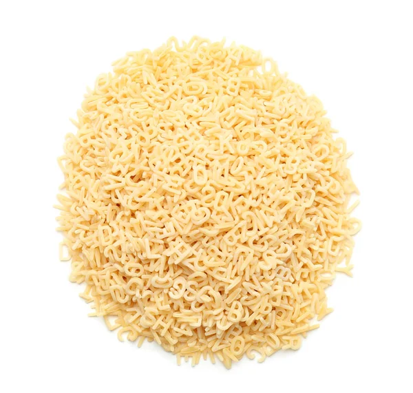 Heap of raw alphabet pasta on white background — Stock Photo, Image