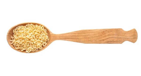 Houten lepel met rauwe alfabet pasta op witte achtergrond — Stockfoto