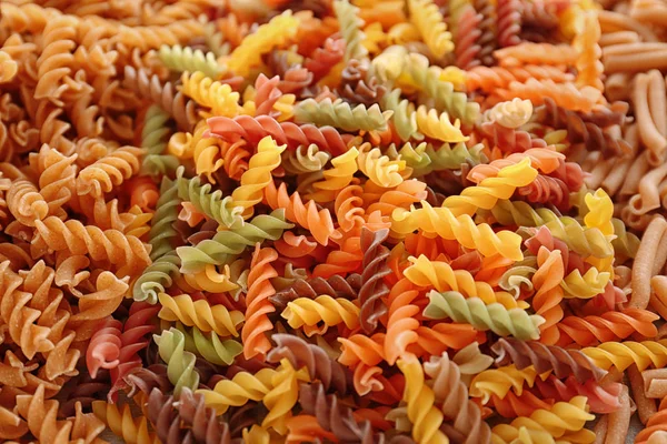 Uncooked pasta as background, closeup — Stock Photo, Image