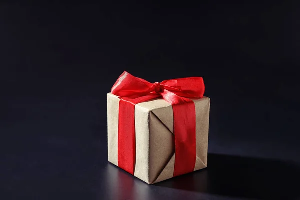 Elegant gift box on dark background — Stock Photo, Image