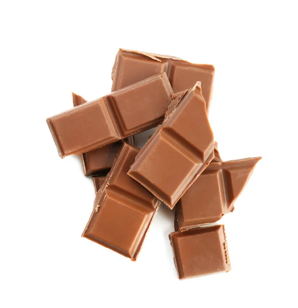 Pieces of milk chocolate on white background — Stock Photo, Image