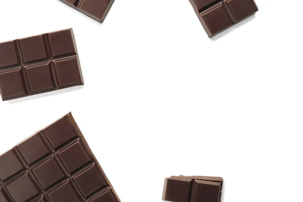 Pieces of dark chocolate on white background — Stock Photo, Image