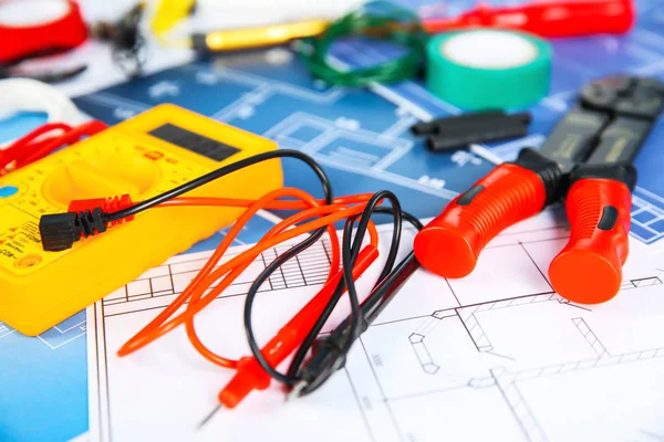 Different electrical tools on house plans, closeup — Stock Photo, Image
