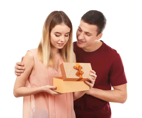 Young woman opening gift box from her boyfriend on white background — Stock Photo, Image