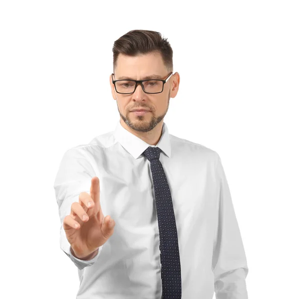 Young businessman using virtual screen on white background — Stock Photo, Image