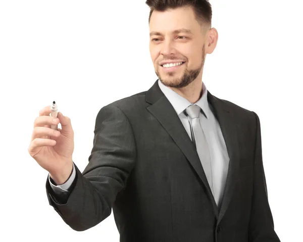 Young businessman writing on virtual screen against white background — Stock Photo, Image