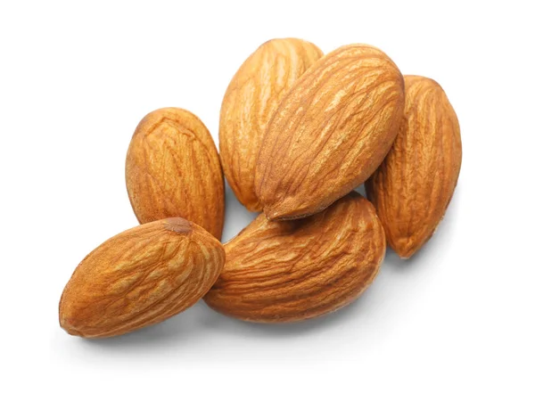 Välsmakande mandel nötter på vit bakgrund — Stockfoto