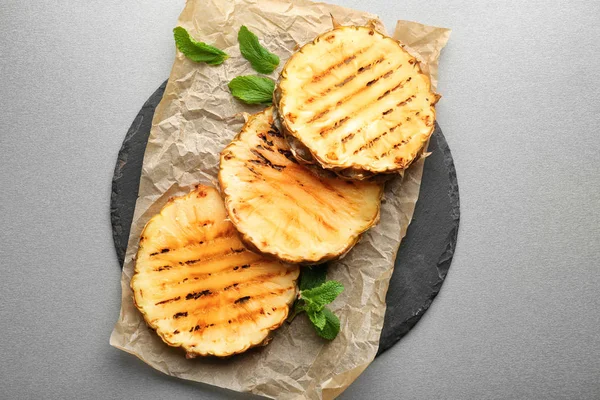 Grilled pineapple slices on table — Stock Photo, Image