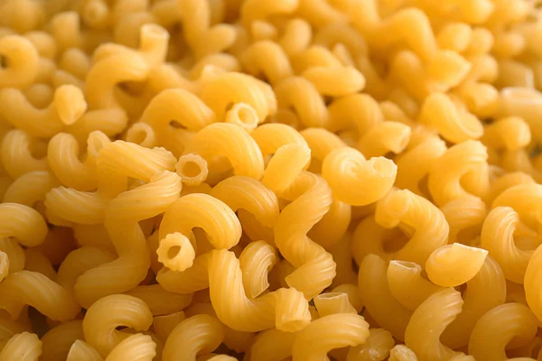 Uncooked pasta as background, closeup — Stock Photo, Image