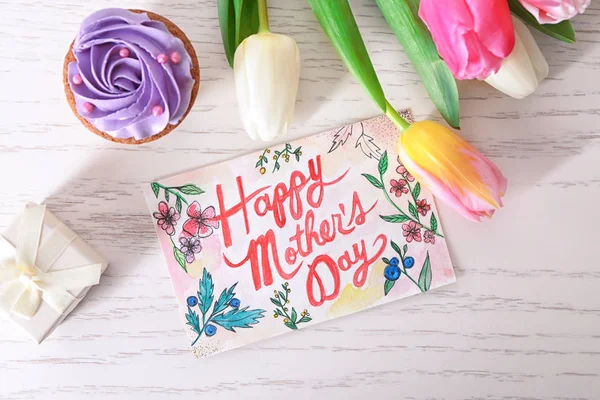 Beautiful composition with handmade card for Mother's Day on white wooden table — Stock Photo, Image
