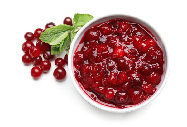 Bowl with tasty cranberry sauce on white background, top view — Stock Photo, Image